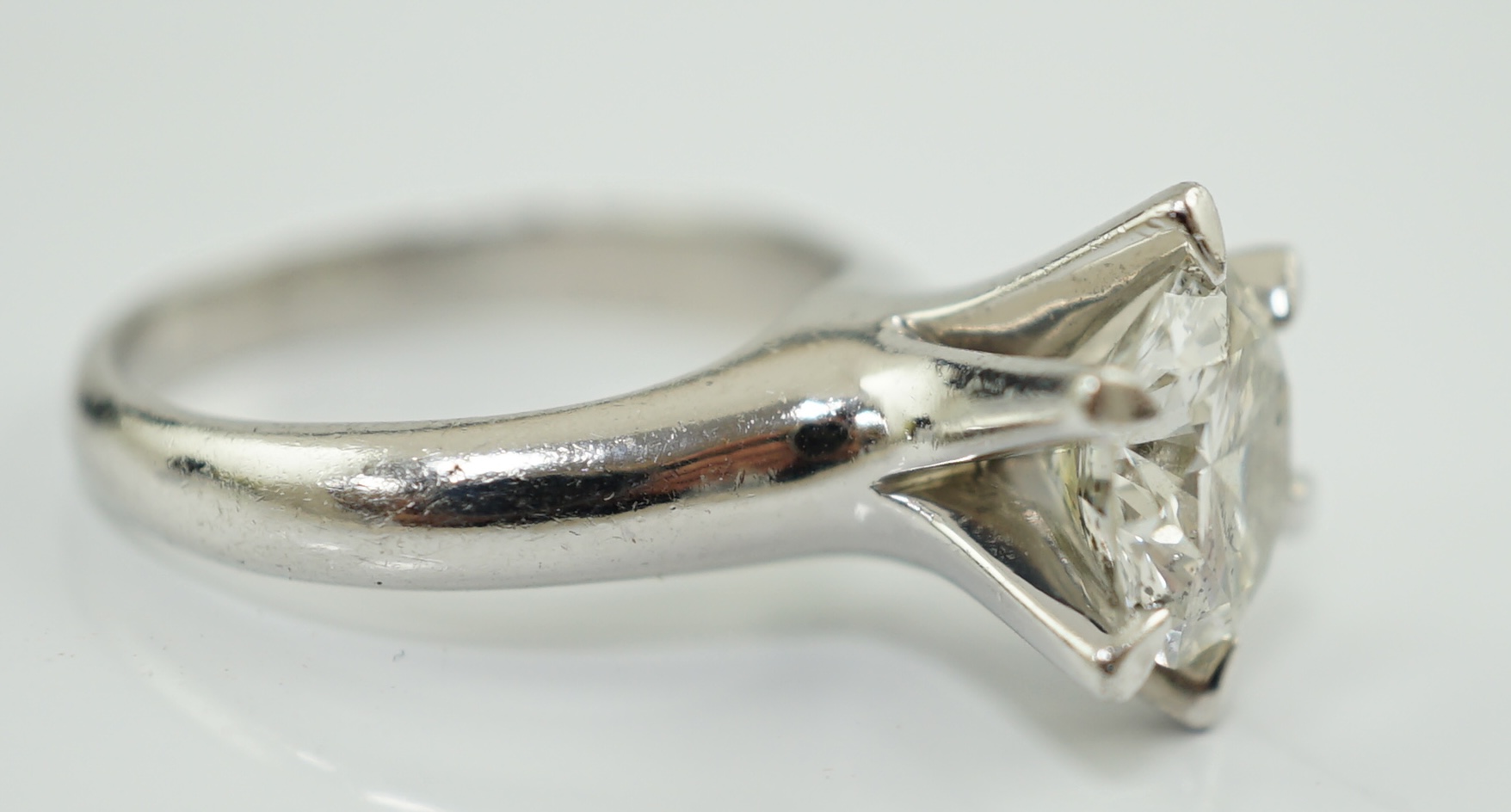 A modern platinum and solitaire diamond set ring